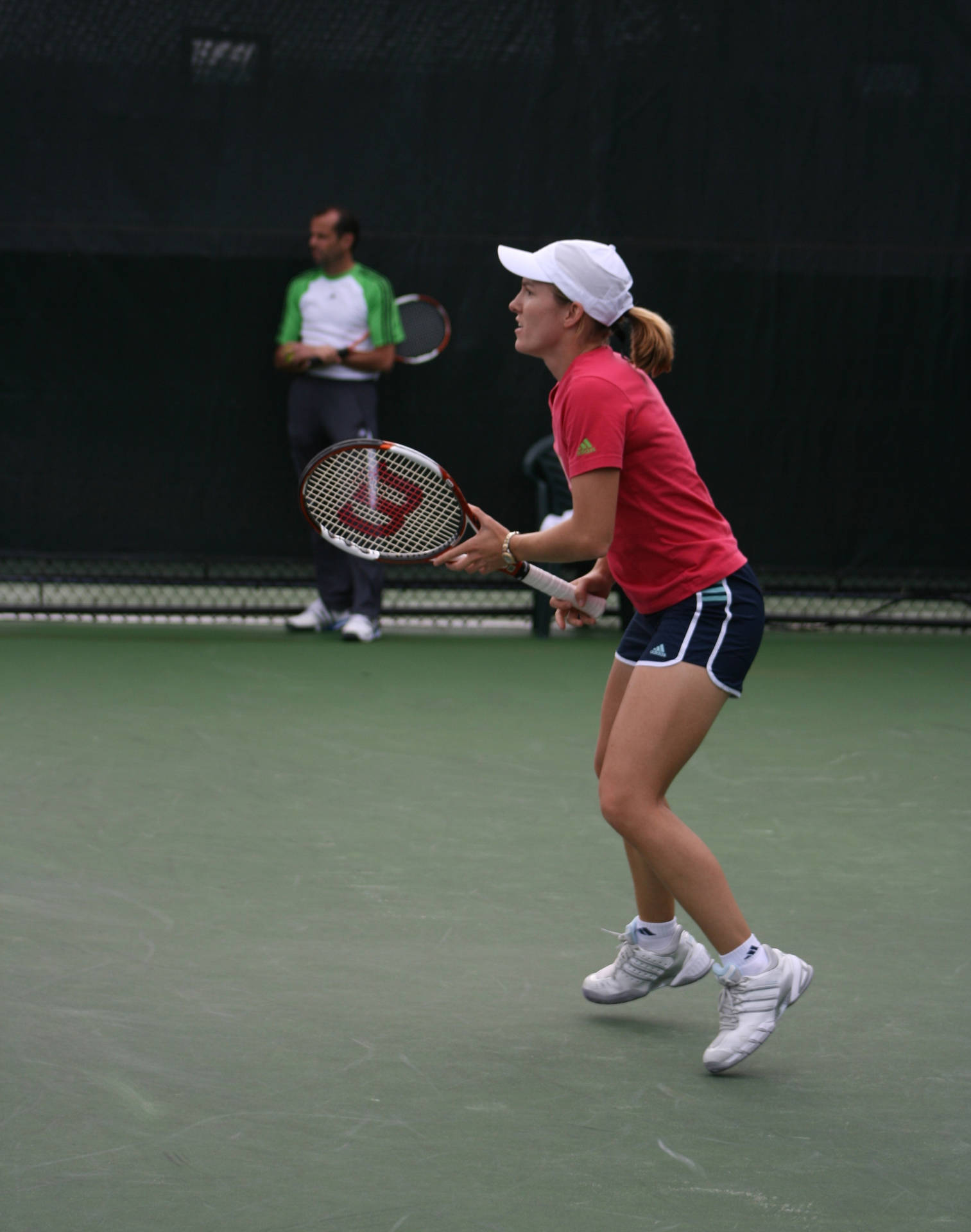 Justine Henin Showcasing Her Skills At The Rogers Cup Background