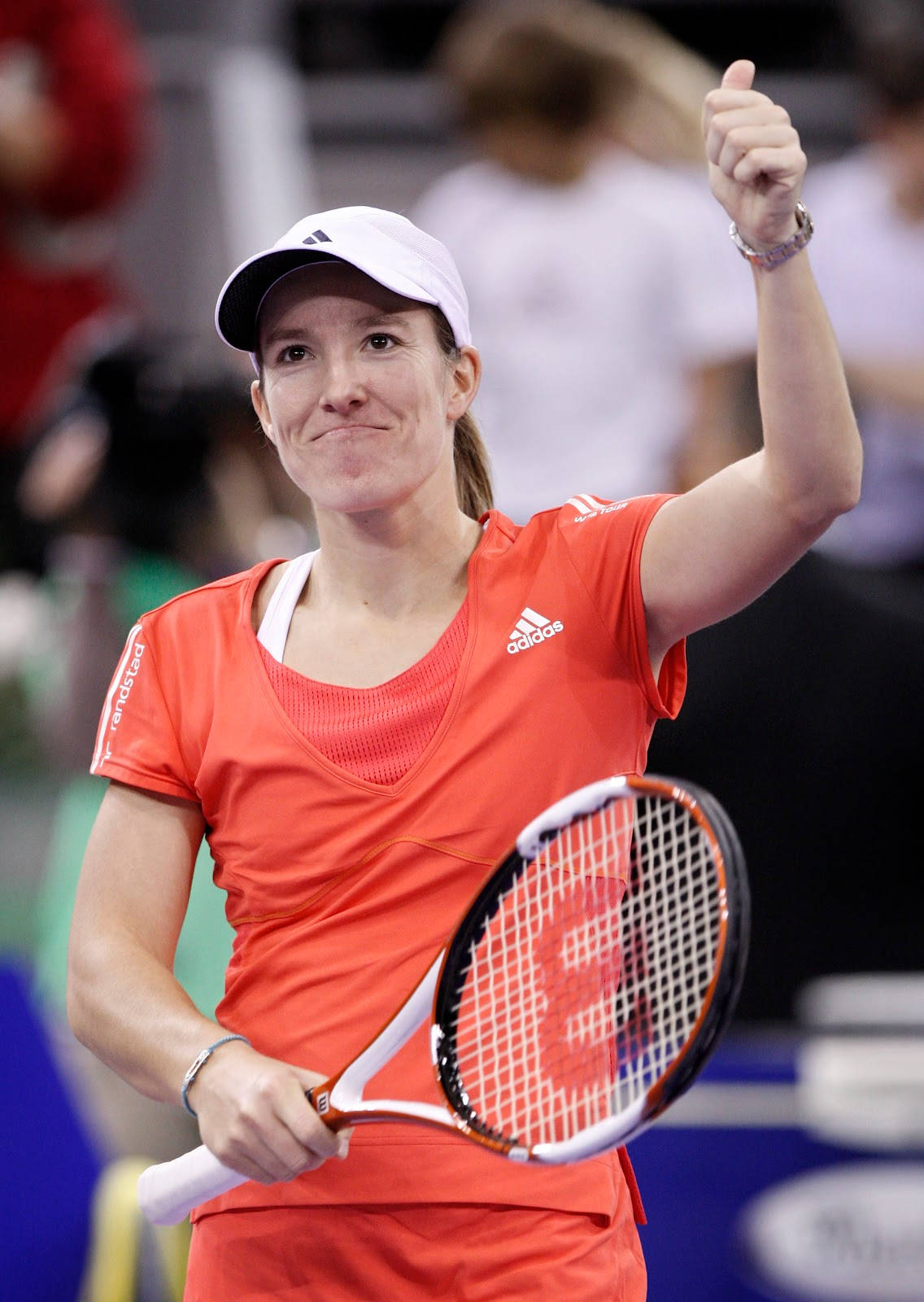 Justine Henin Showing Thumbs Up Background