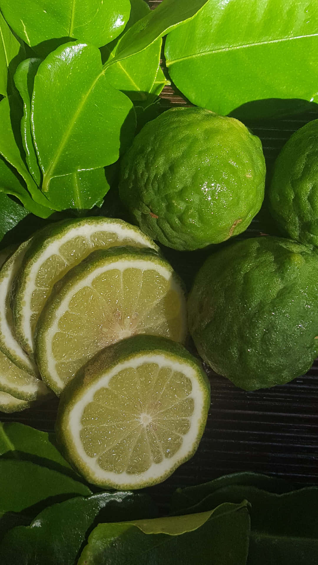 Kaffir Lime Fruits With Green Leaves Background