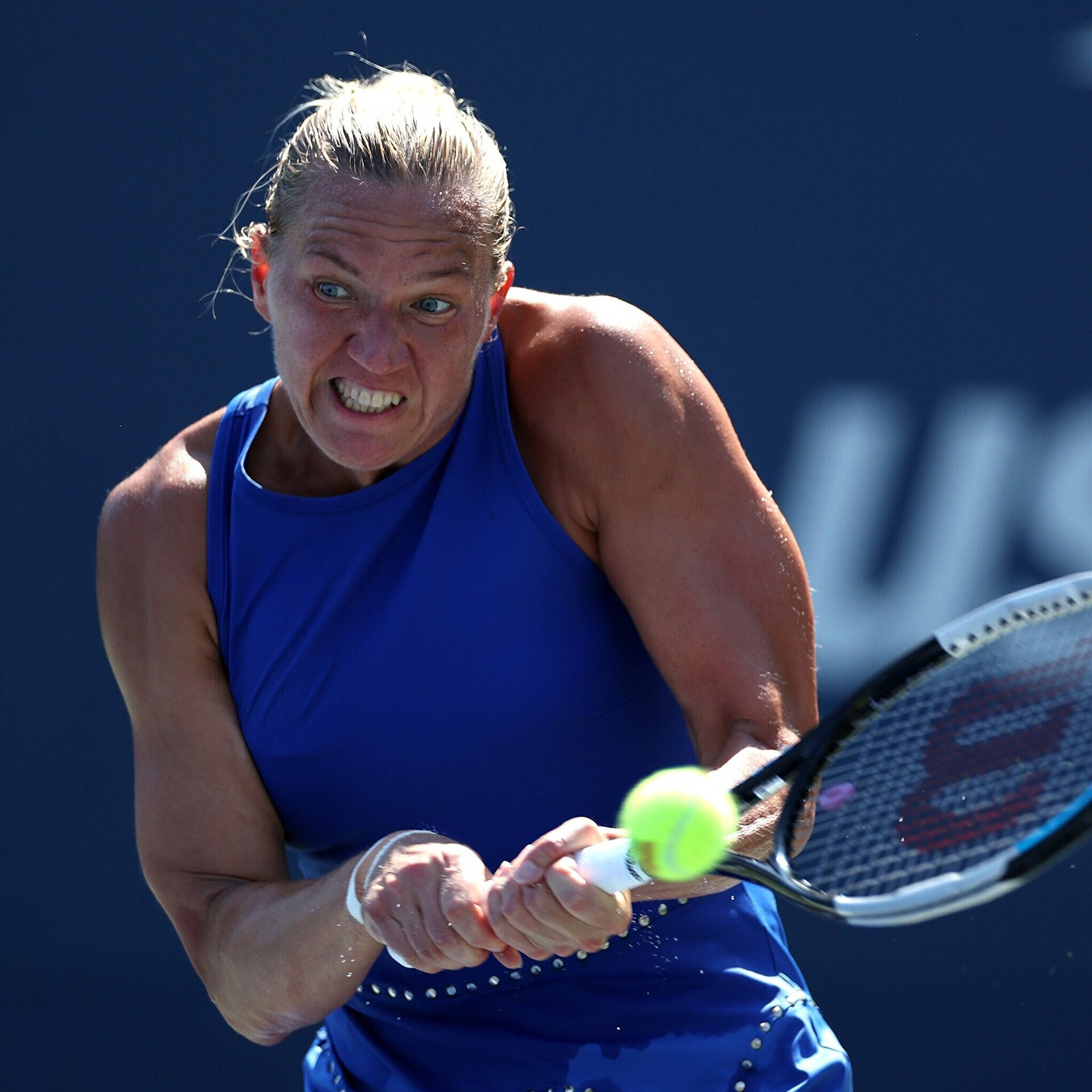 Kaia Kanepi Gripping Racket Tightly Background