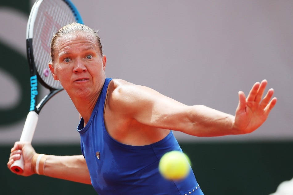 Kaia Kanepi In Action On The Tennis Court Background