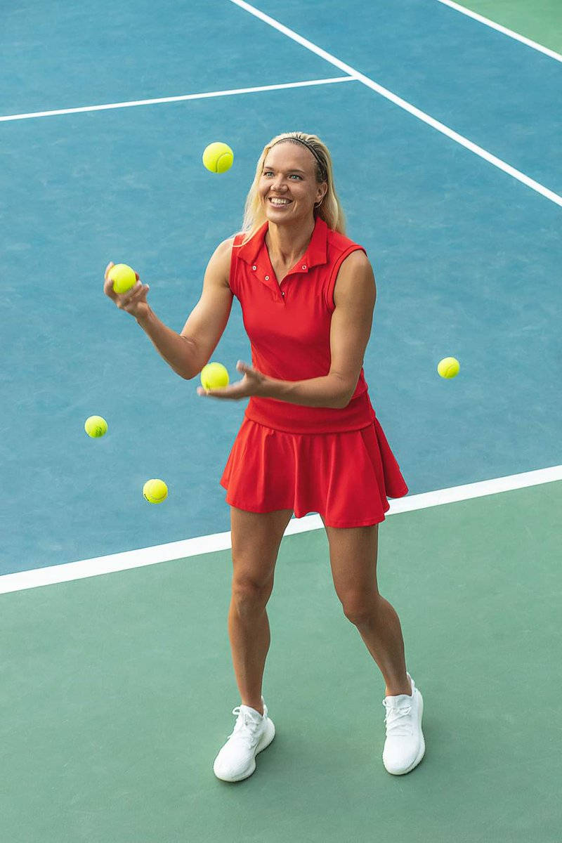 Kaia Kanepi Playing With Tennis Balls Background