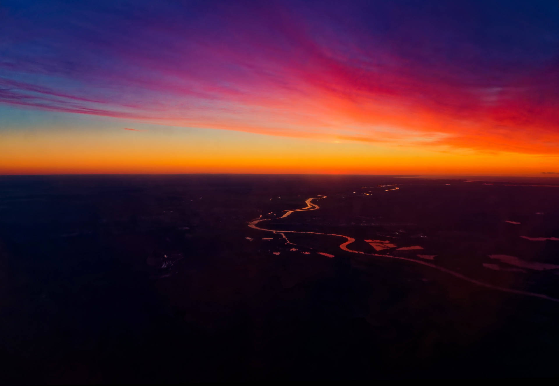 Kaleidoscopic Sunset Sky In Riga Background