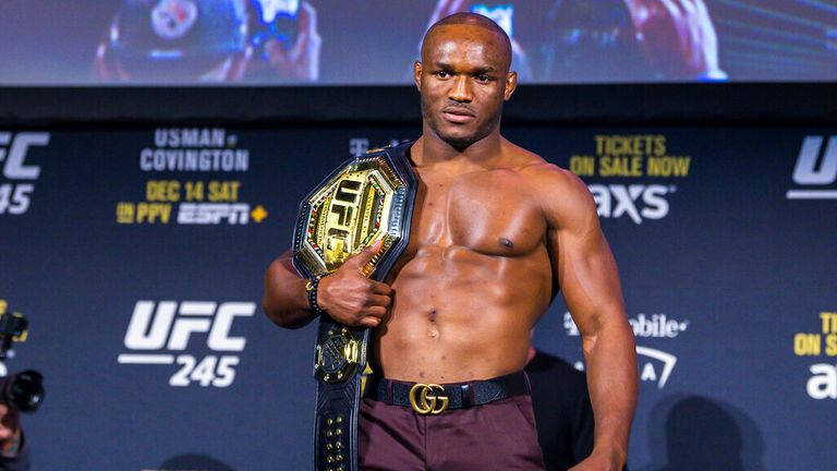 Kamaru Usman Holding His Ufc Belt In Triumph Background