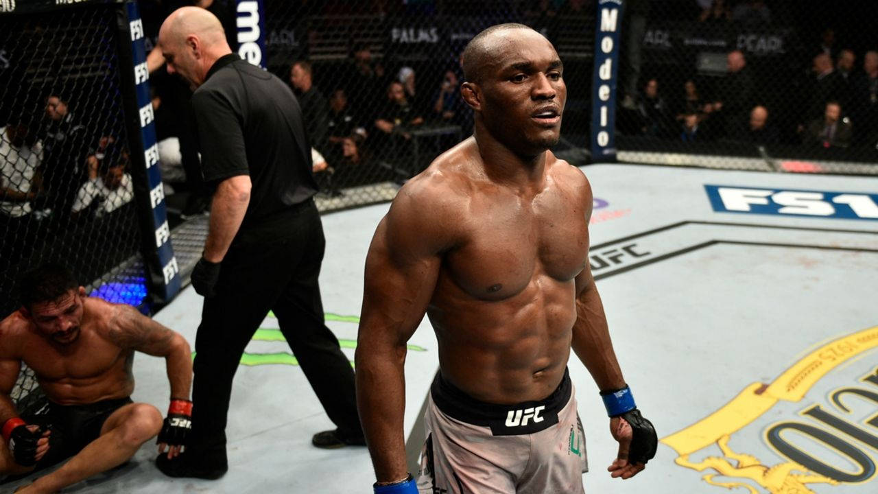 Kamaru Usman Looking Upset Background