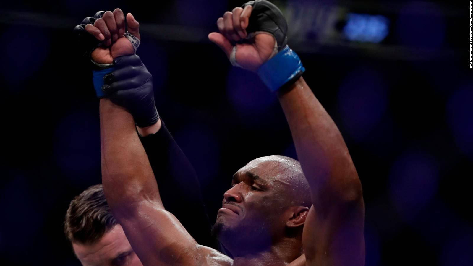 Kamaru Usman Relieved Raised Hands Background