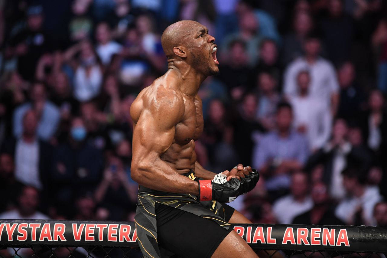 Kamaru Usman Screaming In Victory Background