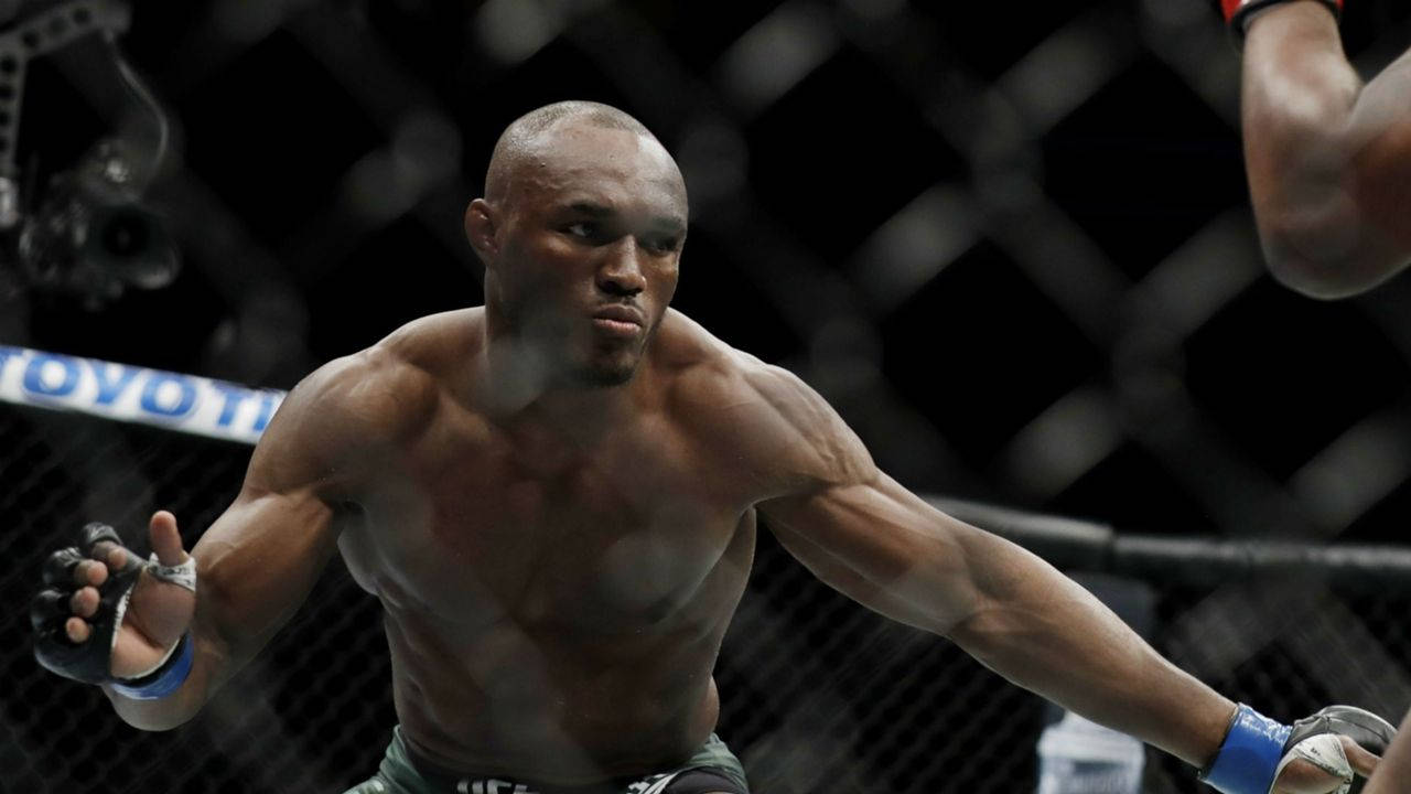 Kamaru Usman Serious Look Background