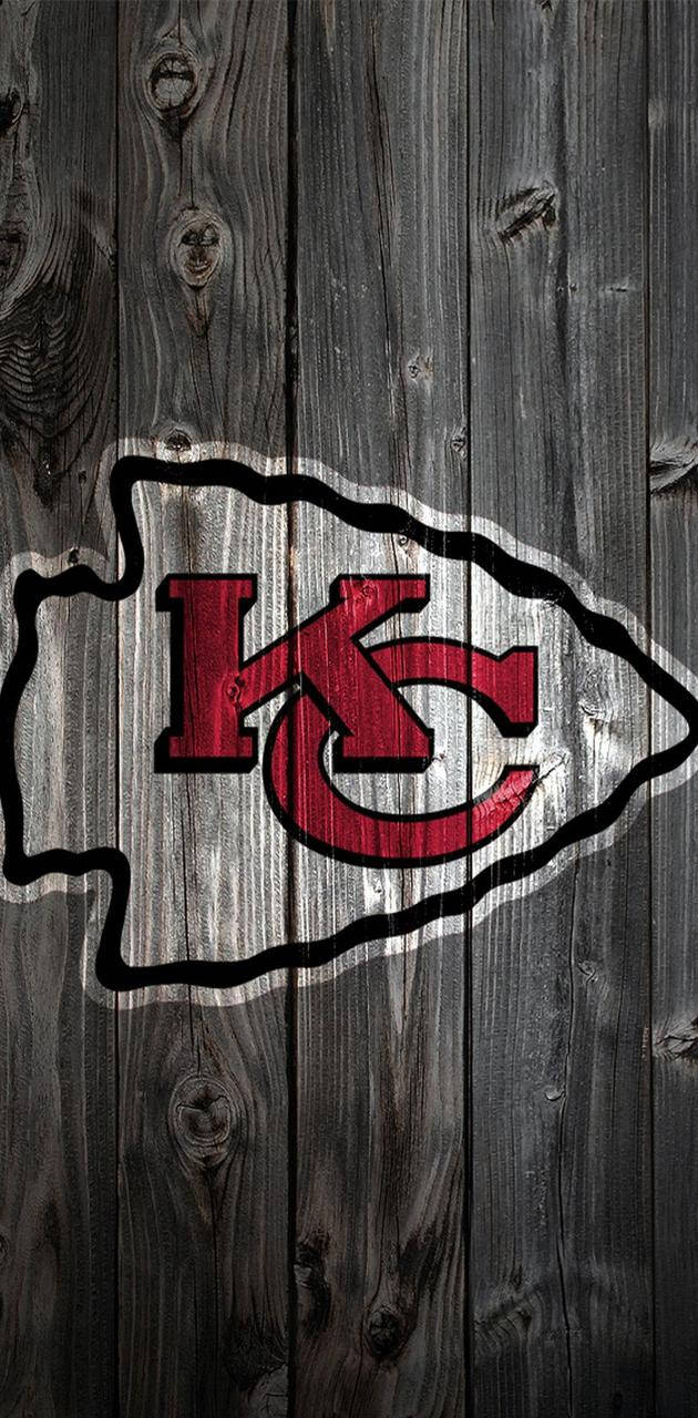 Kansas City Chiefs Logo Dark Wooden Background