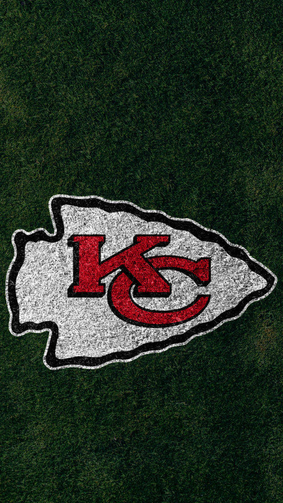 Kansas City Chiefs Logo On Field Background