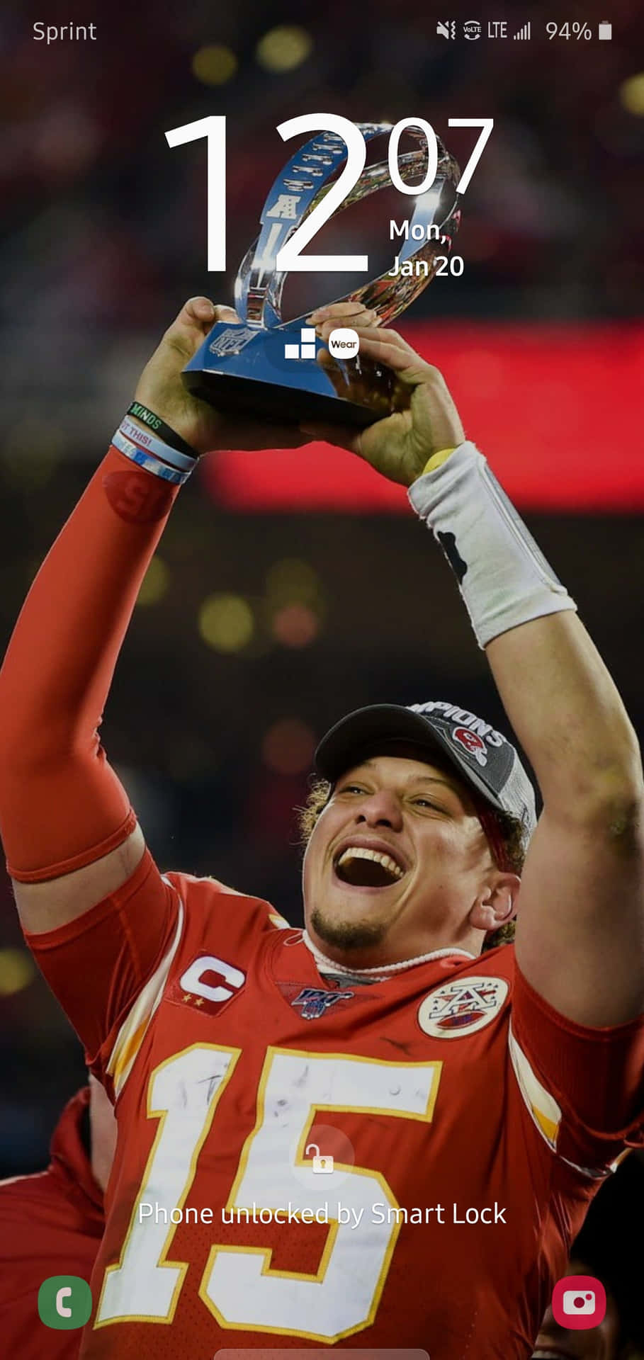 Kansas City Chiefs Quarterback Pat Mahomes Holding His Phone Background