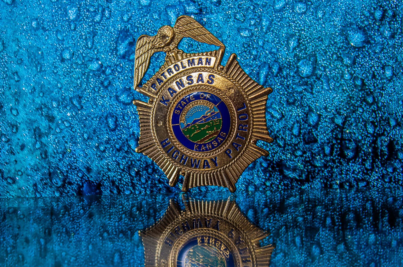 Kansas Highway Patrol Badge Wet Background Background
