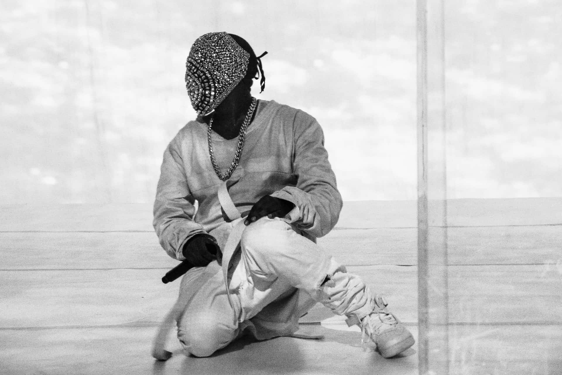 Kanye West Poses With Yeezus Album Artwork. Background