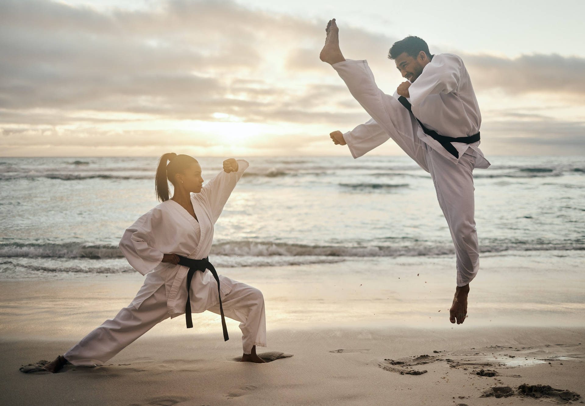 Karate Fight At Beach During Sunset Background