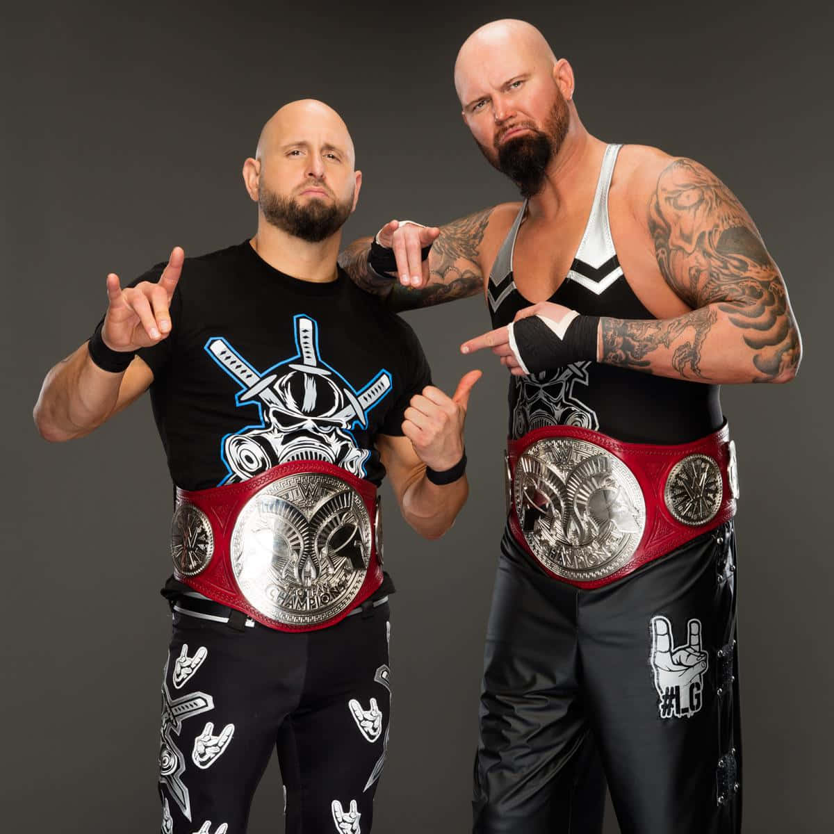 Karl Anderson And Doc Gallows Pose In A Professional Photoshoot Background