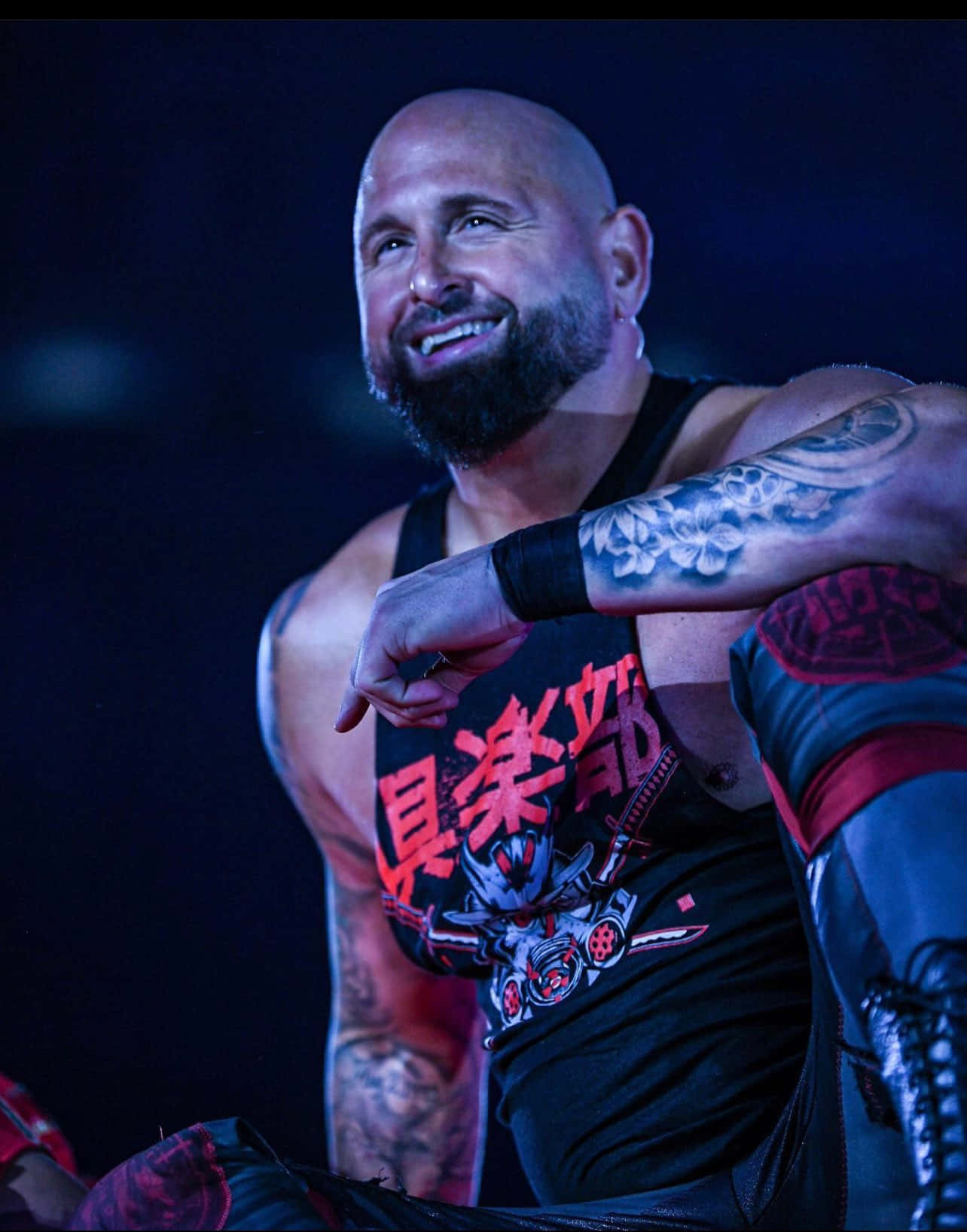Karl Anderson Smiling Brightly Background
