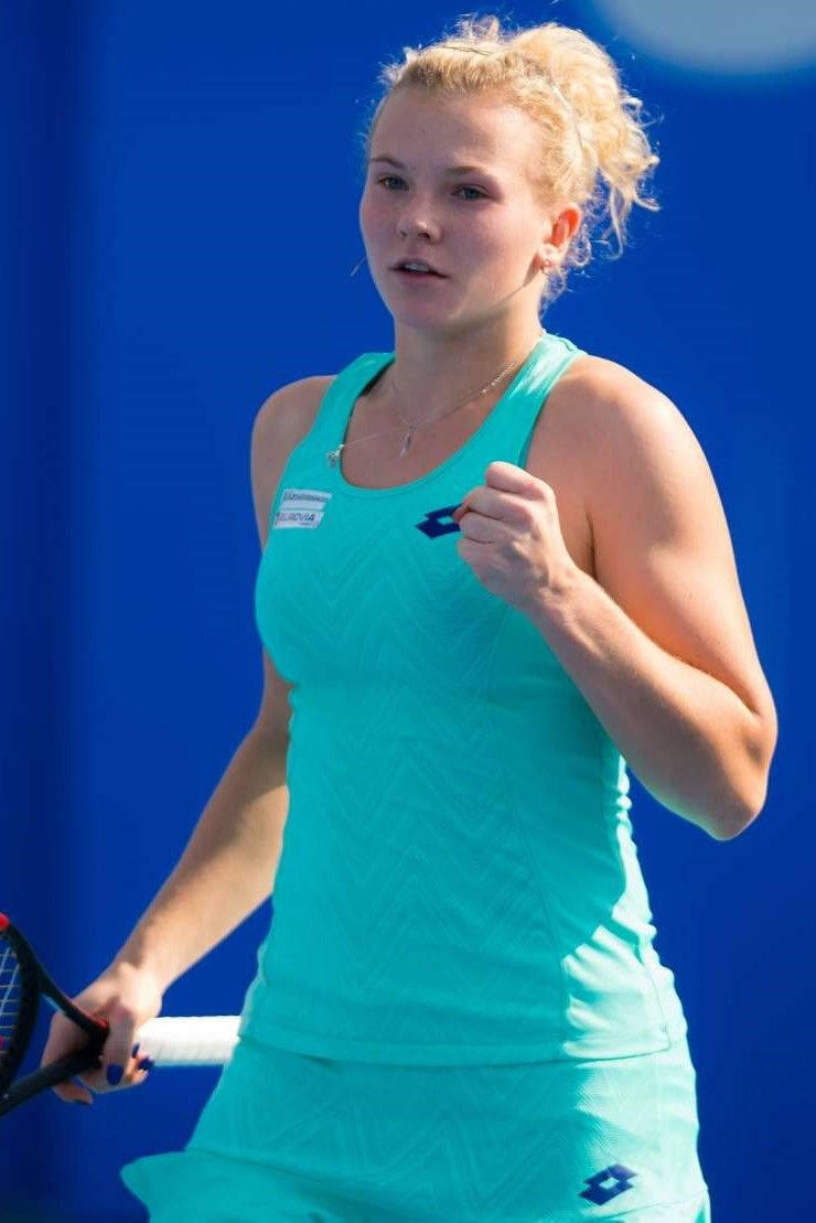 Katerina Siniakova Smiling Fist Pump Background