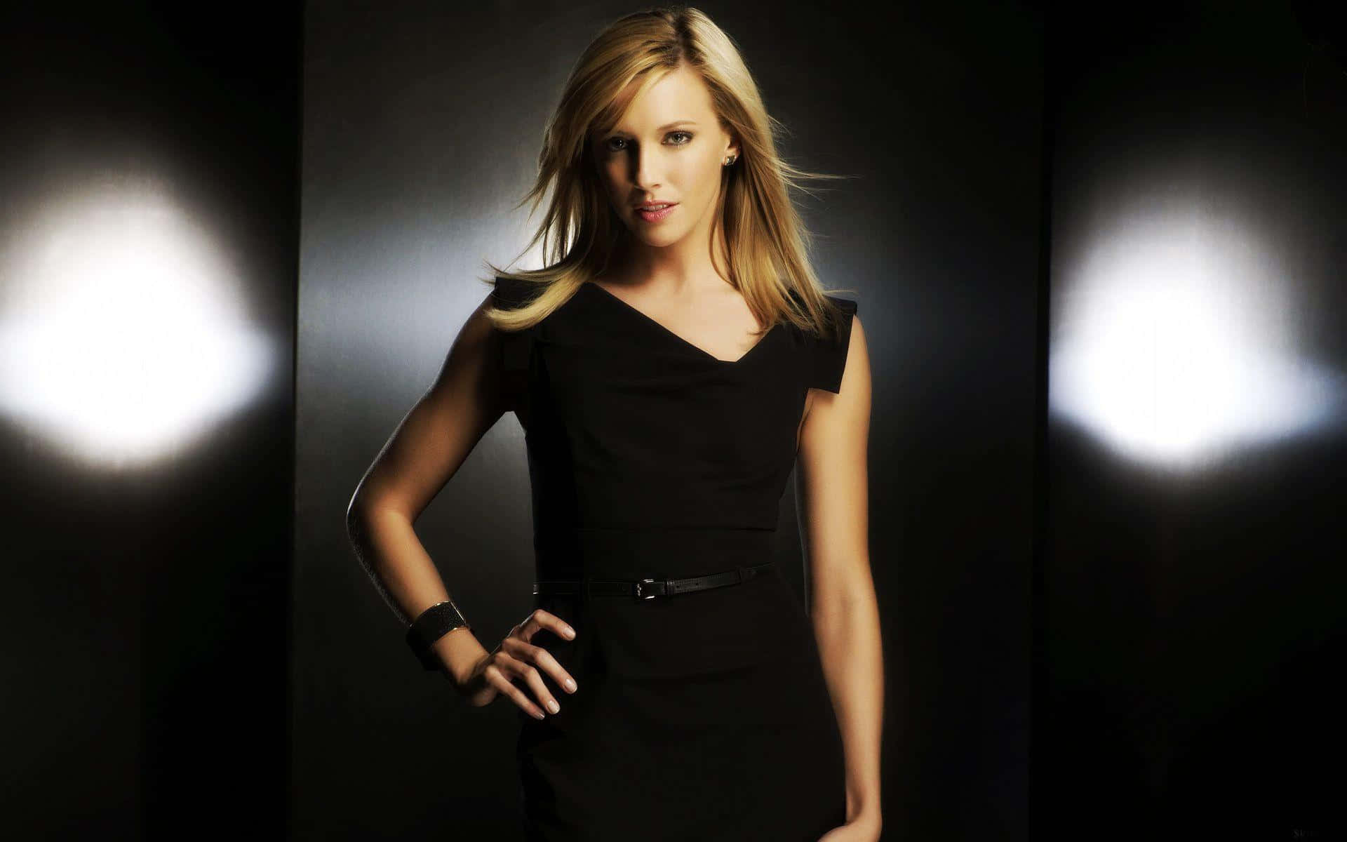 Katie Cassidy Posing In An Elegant Outfit Background