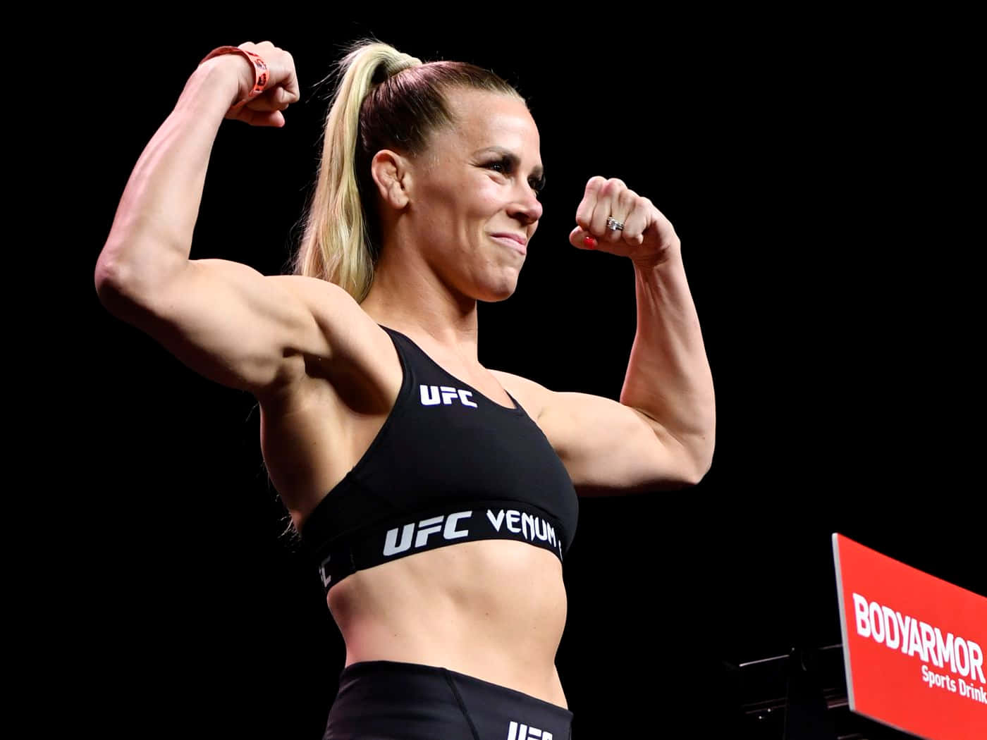 Katlyn Chookagian Flexing Side-angle Shot Background