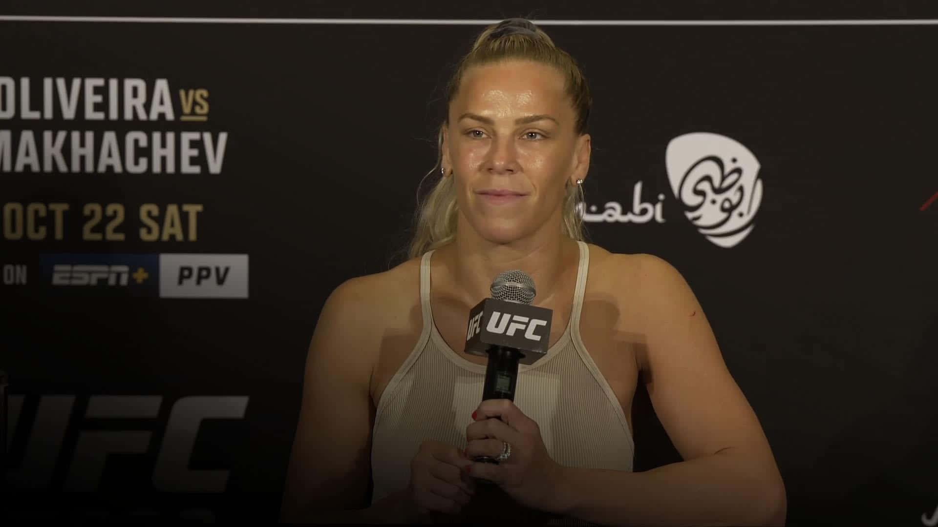 Katlyn Chookagian Holding A Microphone Background