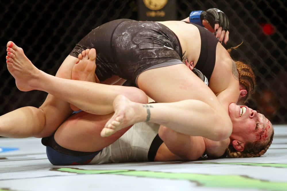 Katlyn Chookagian Tackled By Opponent Background