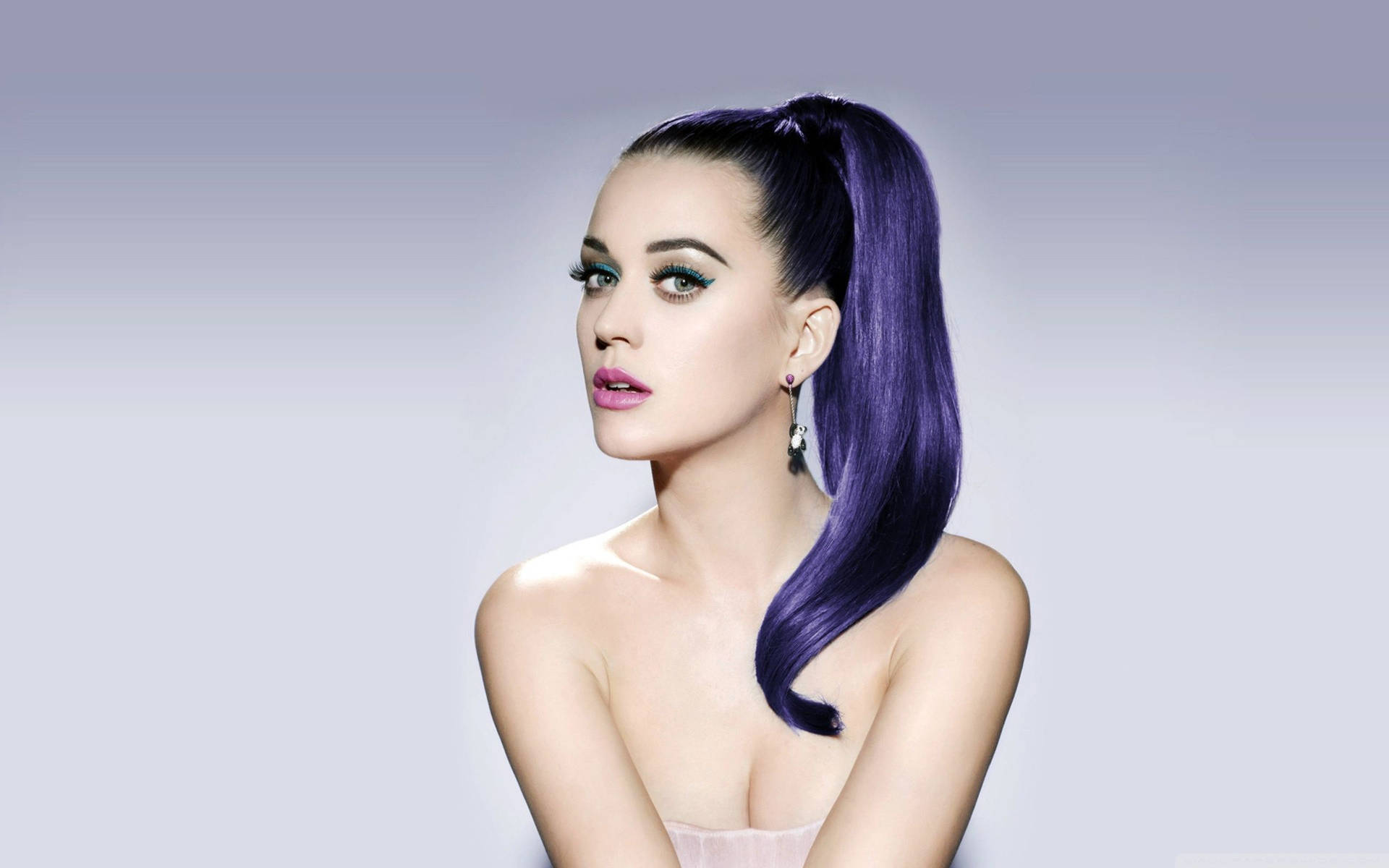 Katy Perry Models A Colorful Purple Ponytail Background