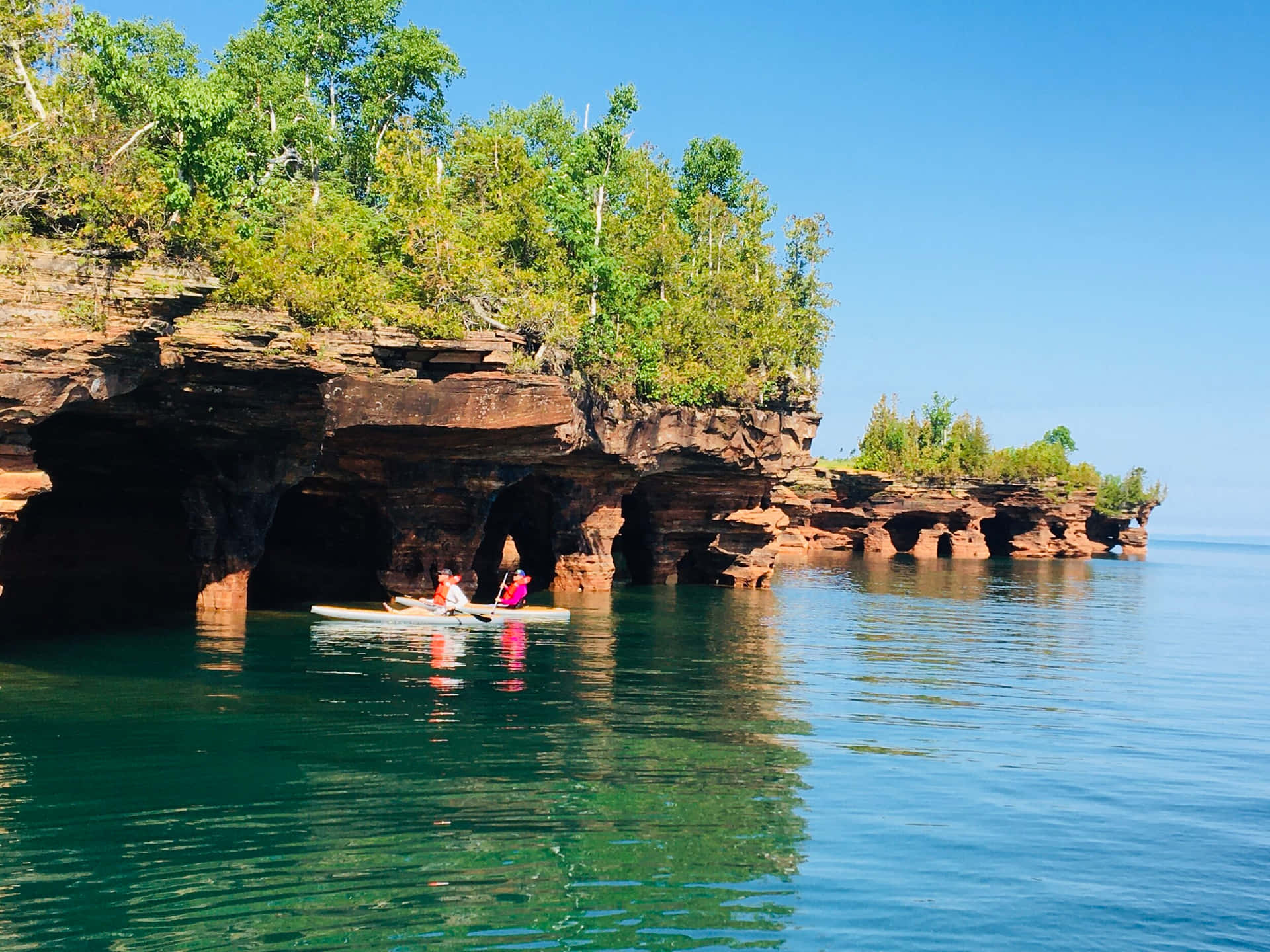 Kayaking Near Sea Caves Background