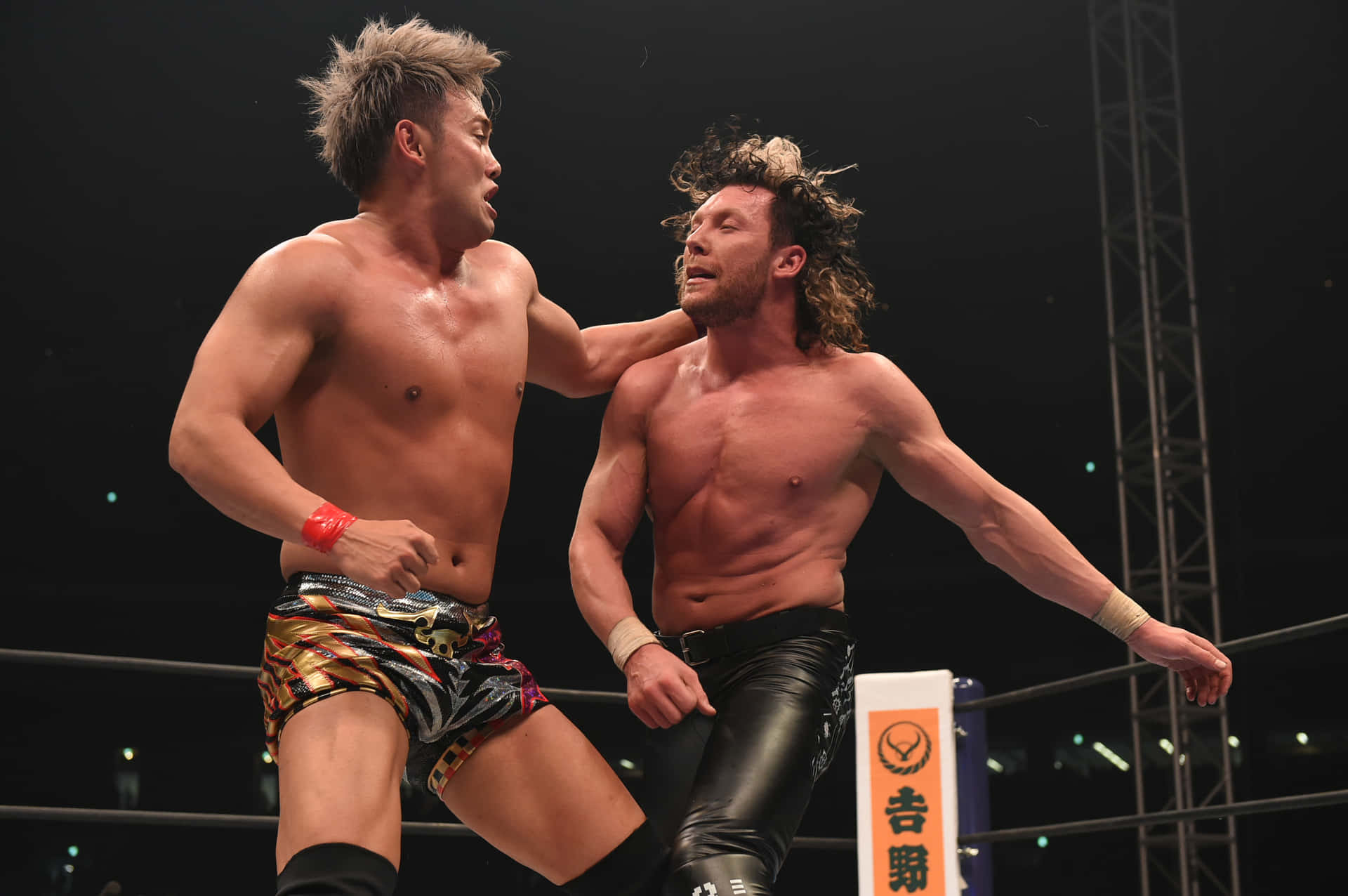 Kazuchika Okada Punching Kenny Omega Background