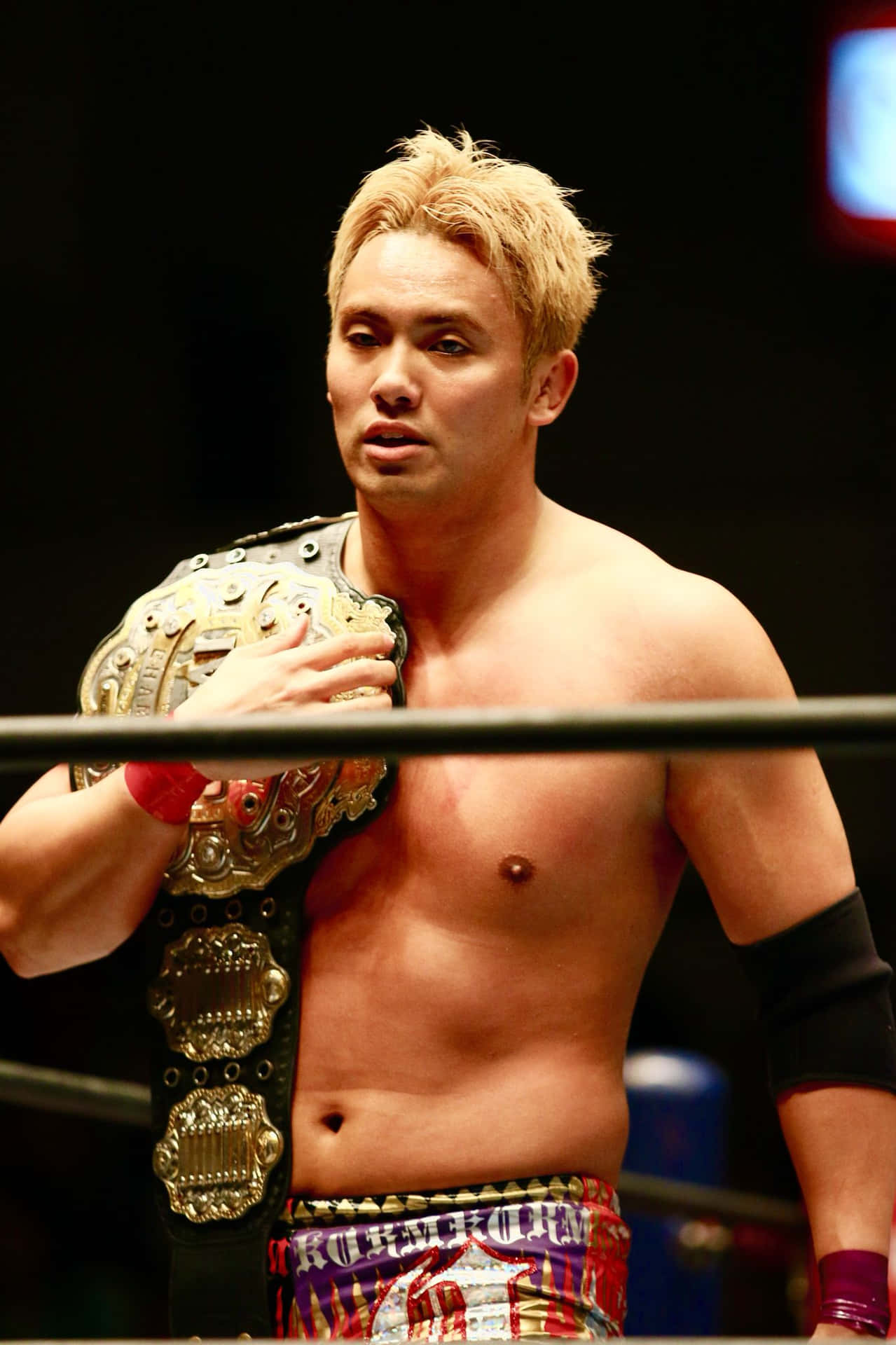 Kazuchika Okada Roaring In Victory As The Undisputed Njpw Champion Background