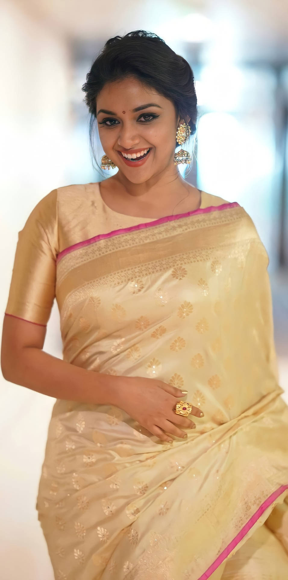 Keerthi Suresh Graces In A Pale Gold Sari Background