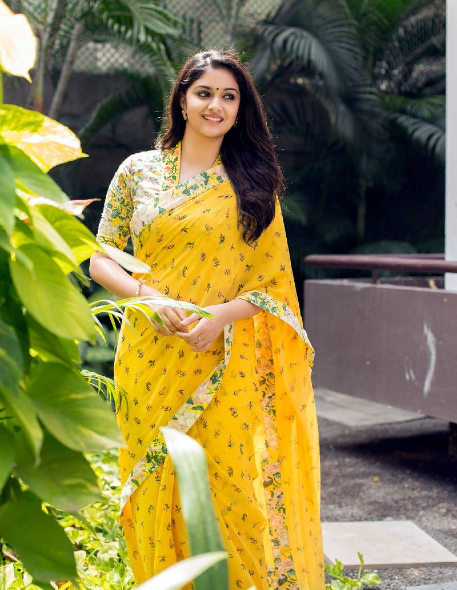 Keerthi Suresh In Sari By A Plant Hd Background