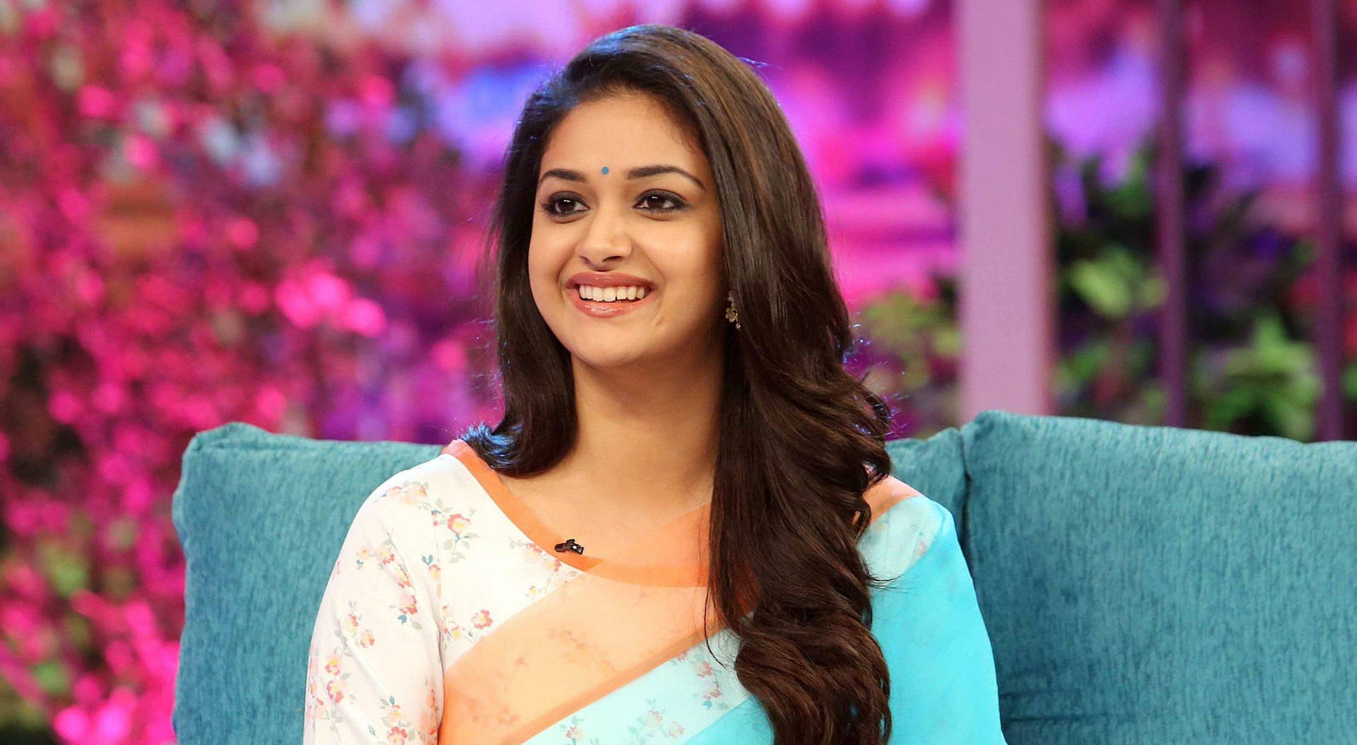 Keerthi Suresh Sitting On Blue Couch Hd