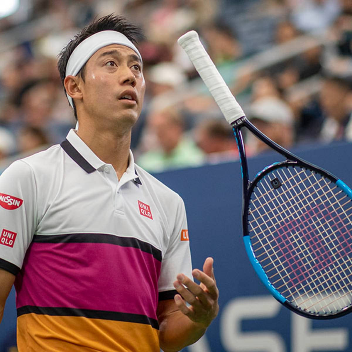 Kei Nishikori Expertly Performs A Racket Flip During A Match