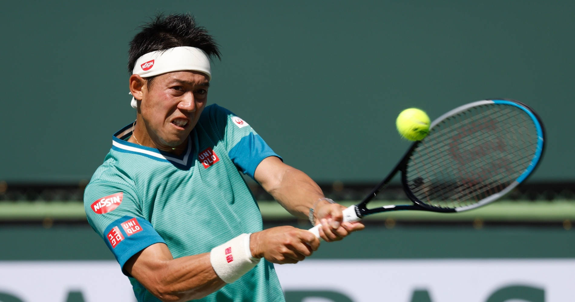 Kei Nishikori Perfecting A Groundstroke Shot Background