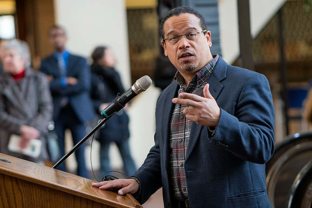 Keith Ellison Behind Lectern Background