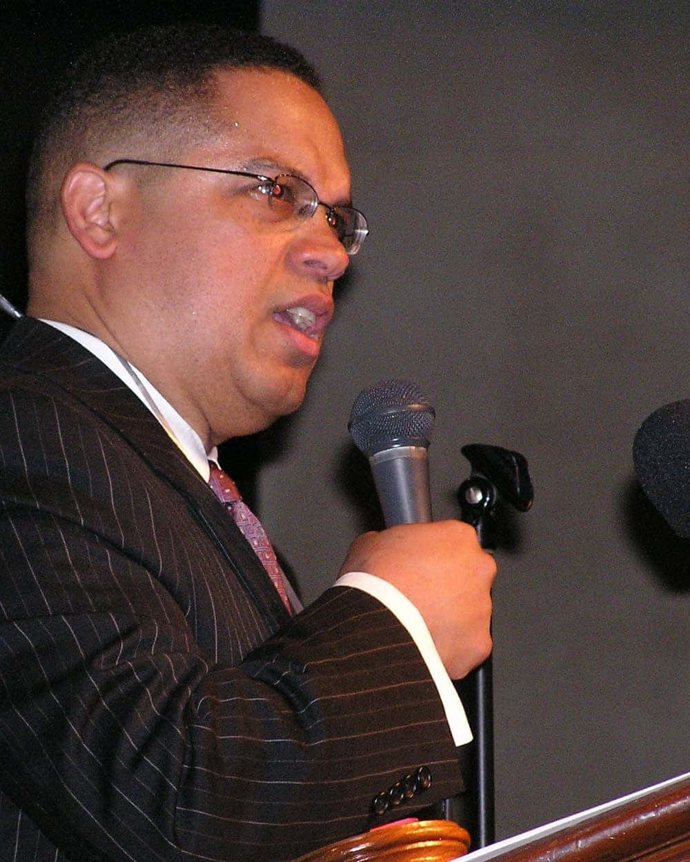 Keith Ellison Delivering Speech Background