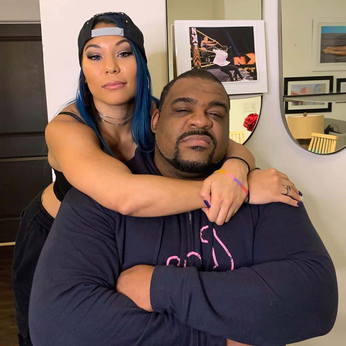 Keith Lee Embraces Mia Yim In A Heartfelt Moment Background