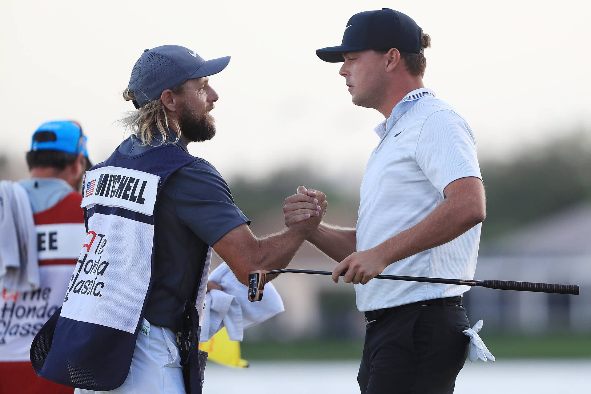 Keith Mitchell Handshaking His Caddie Background