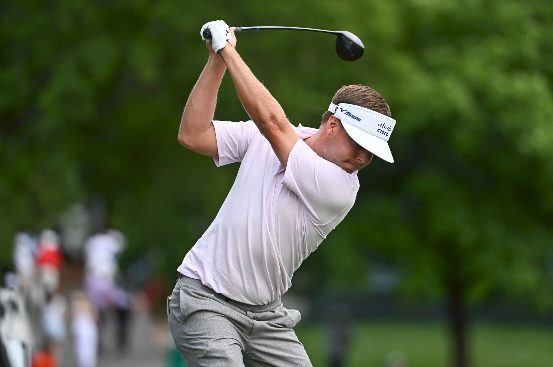 Keith Mitchell Striking A Golf Ball Background