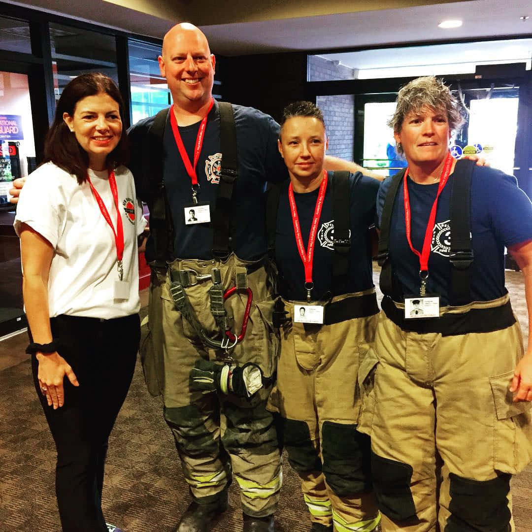 Kelly Ayotte With Firefighters Background