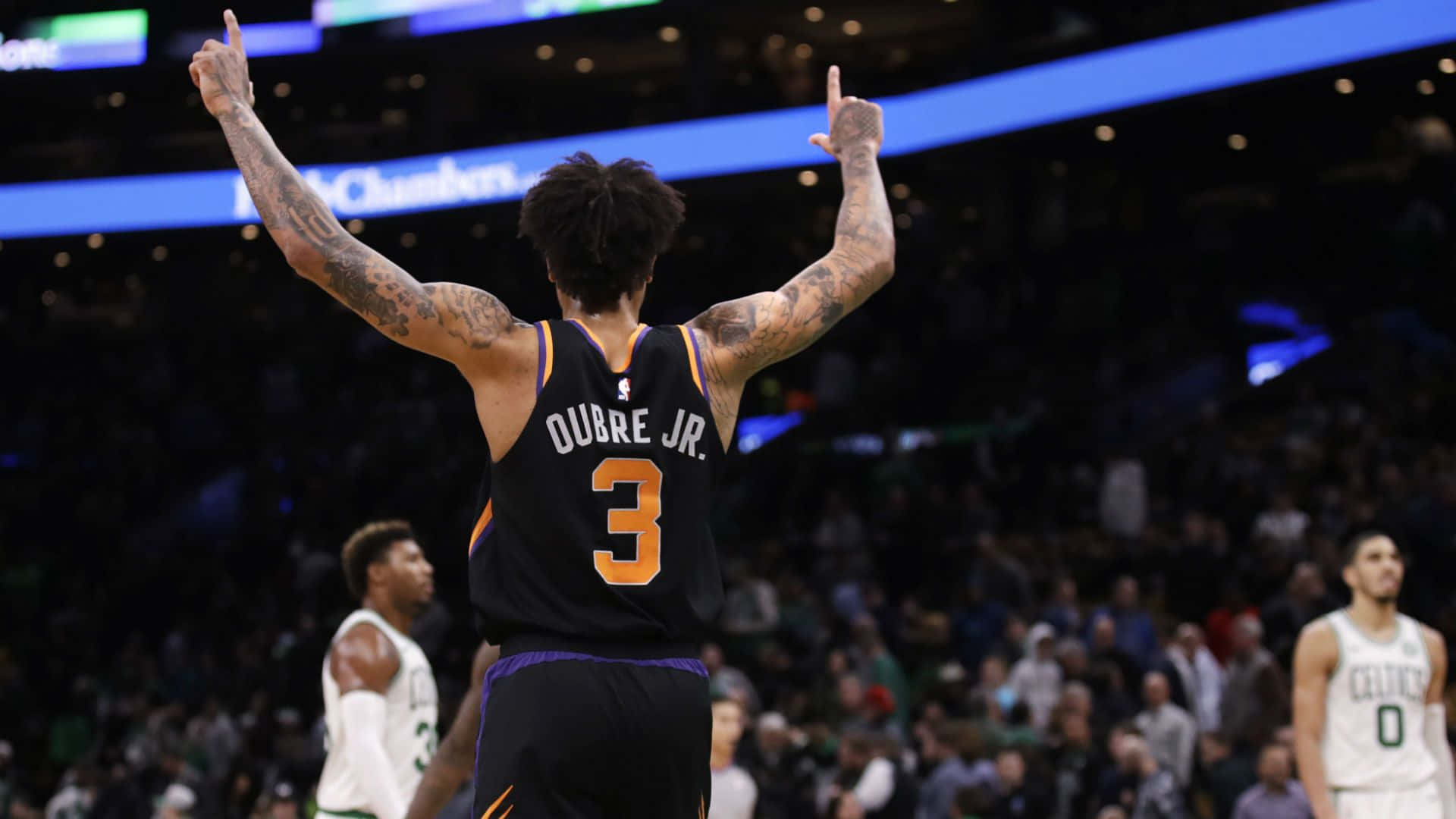 Kelly Oubre Jr Takes Flight On The Hardwood Background
