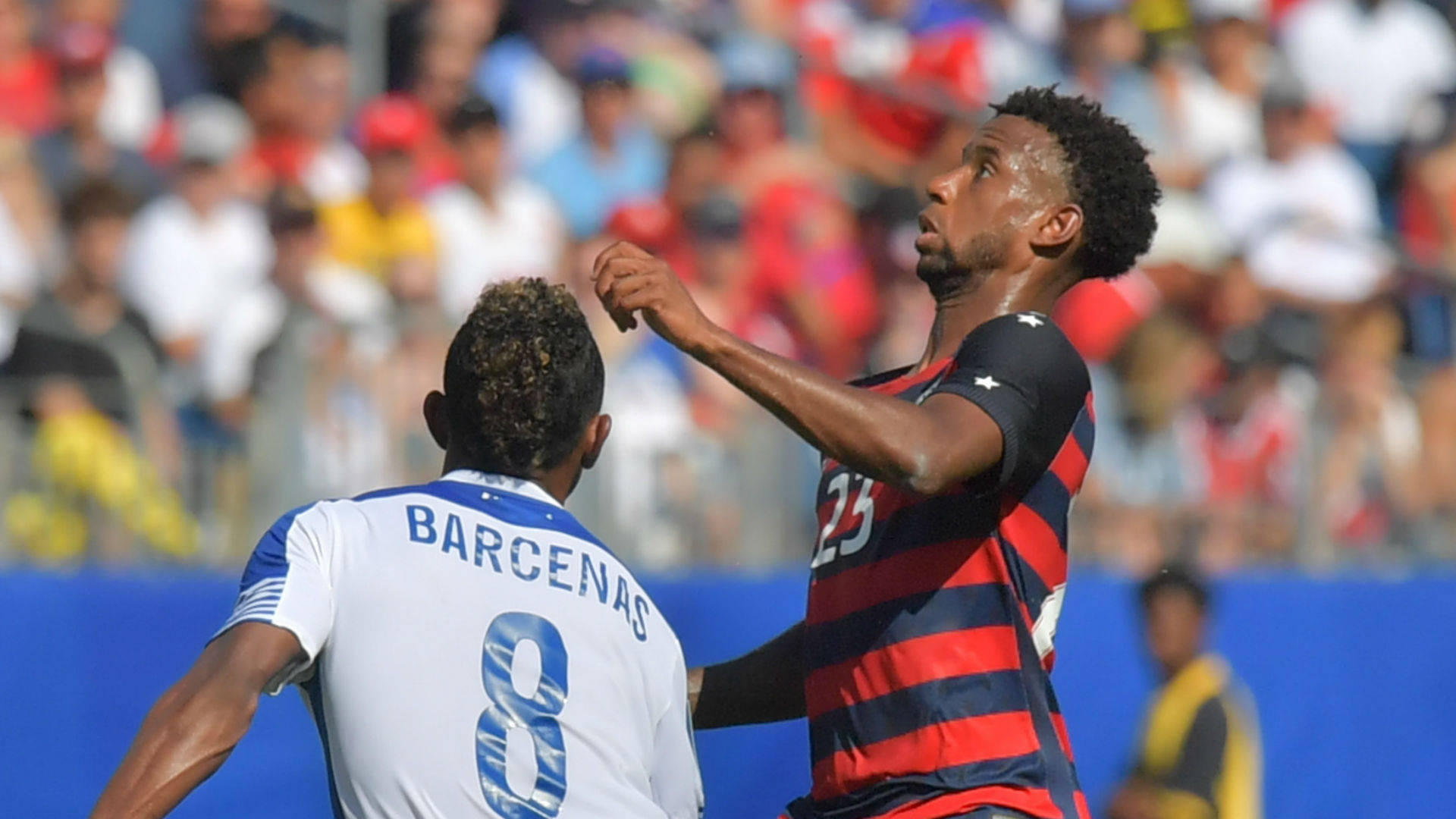 Kellyn Acosta Jumping Football Against Martinique Background