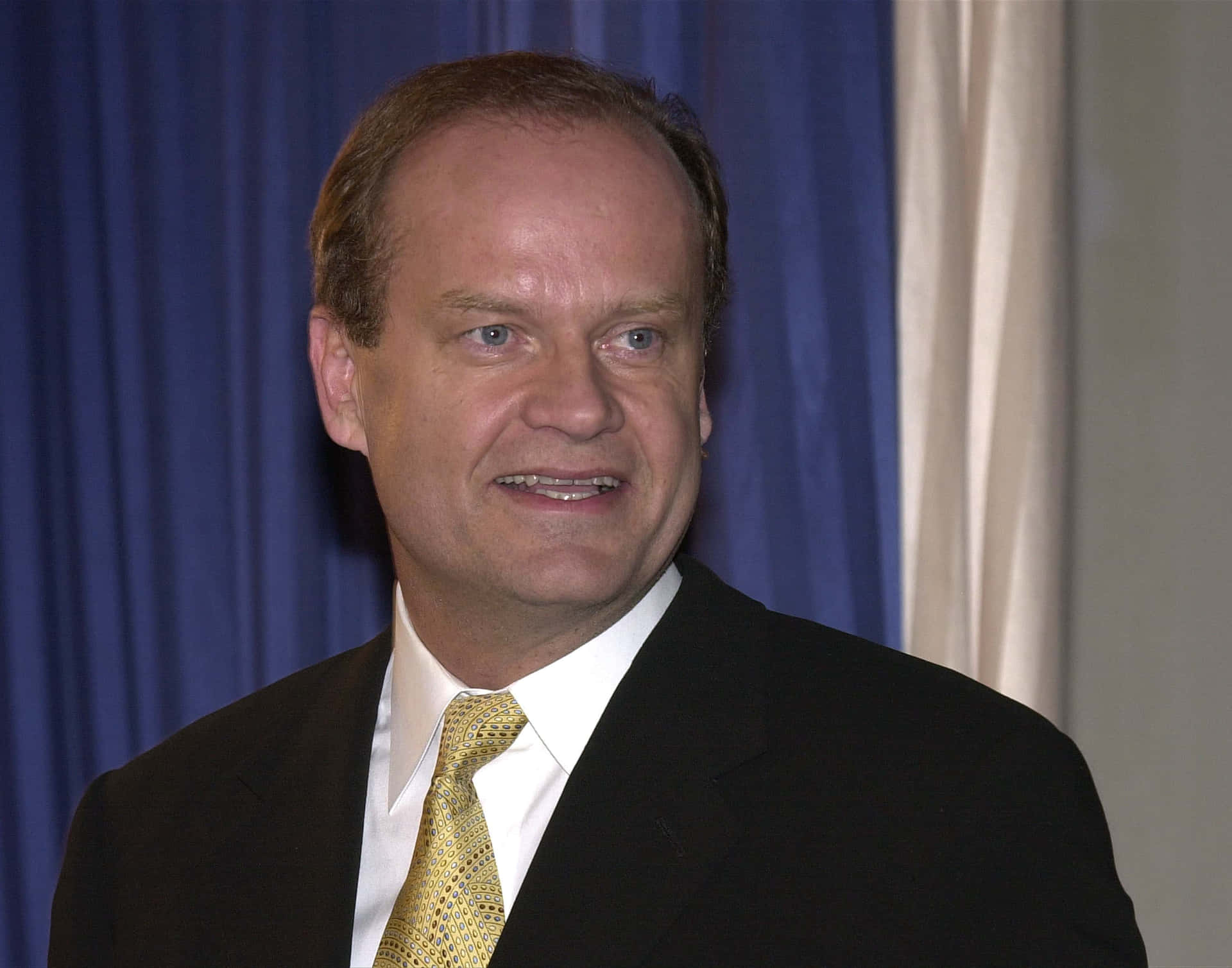 Kelsey Grammer Striking A Pose Background
