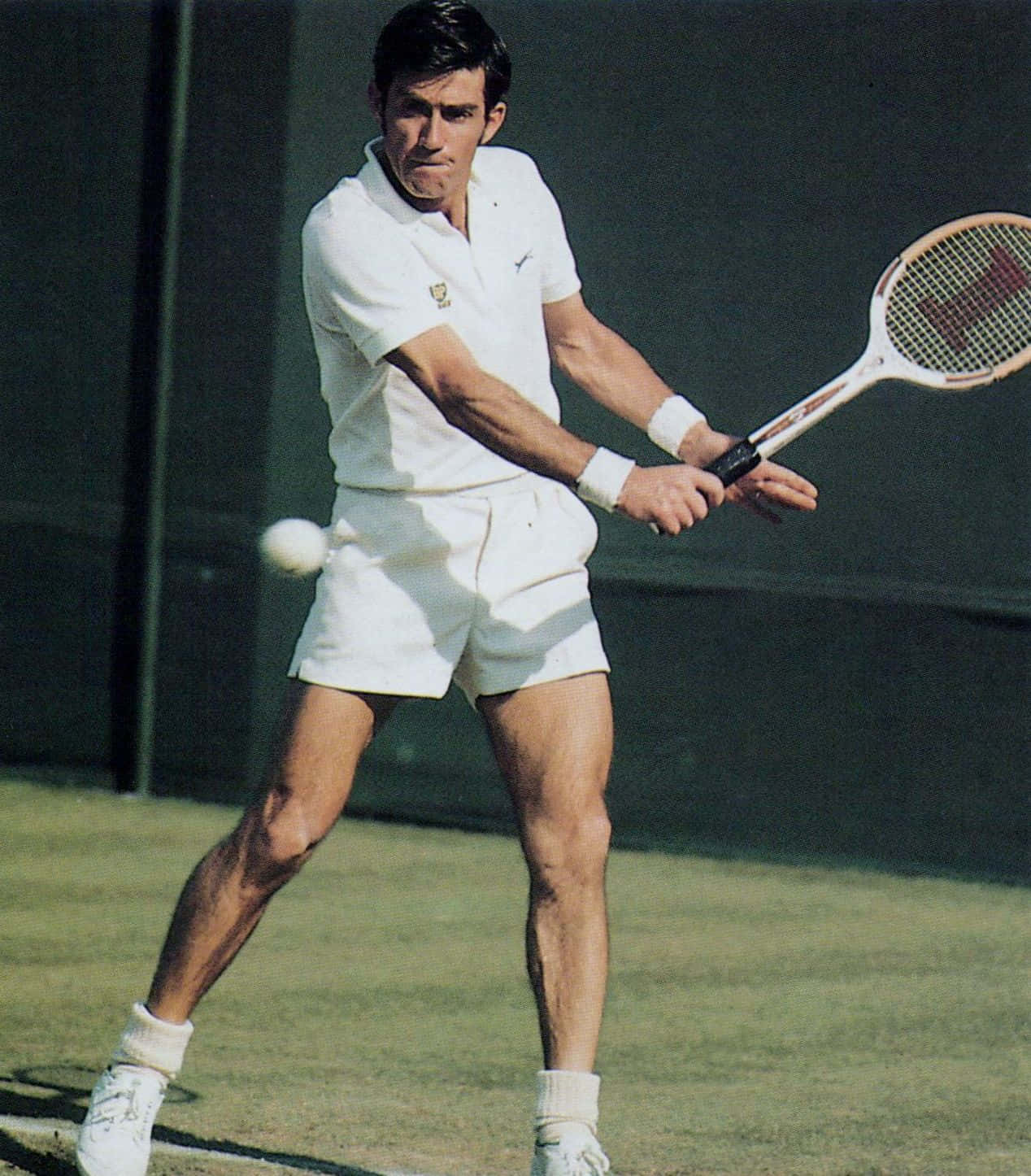 Ken Rosewall Executing An Impressive Tennis Shot Background