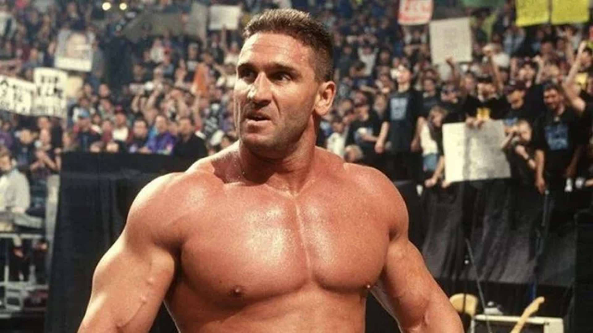 Ken Shamrock Amid Cheering Crowd Background