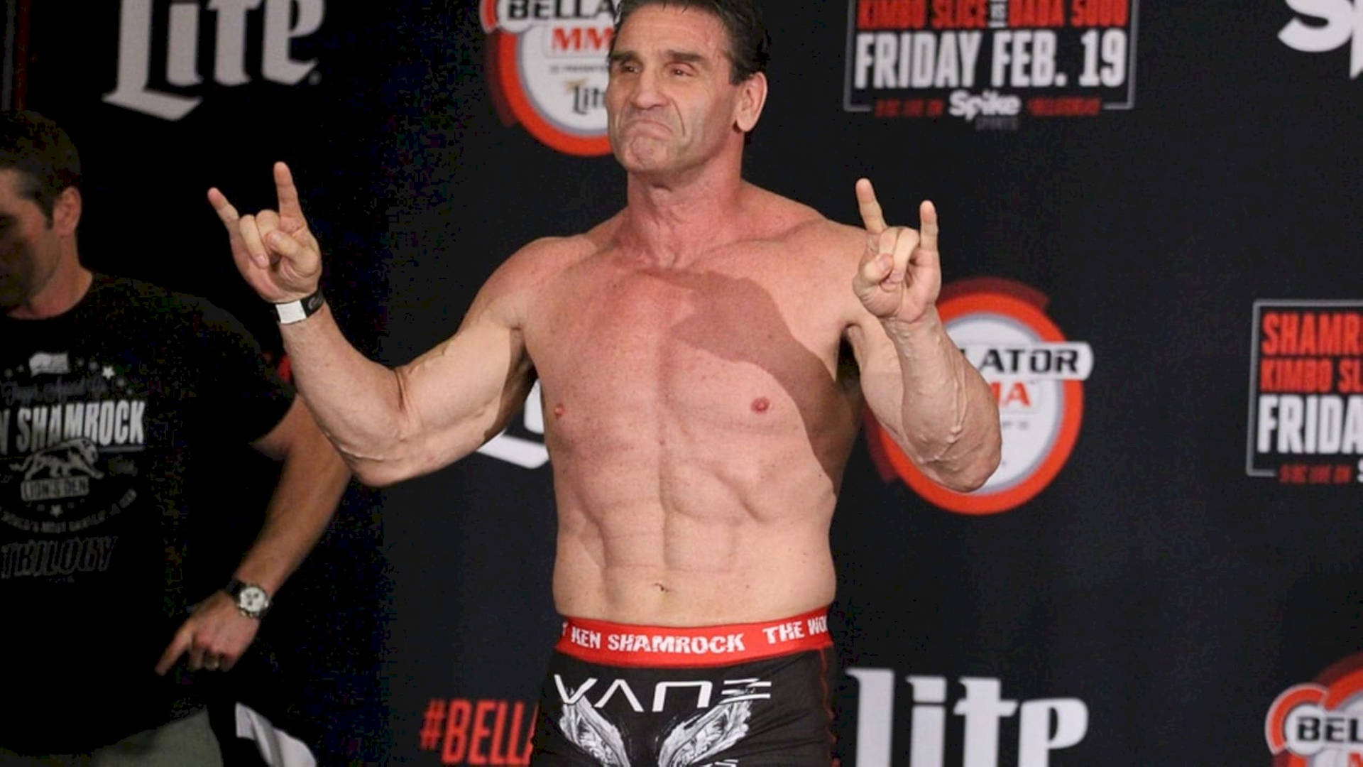 Ken Shamrock Rock And Roll Sign Background