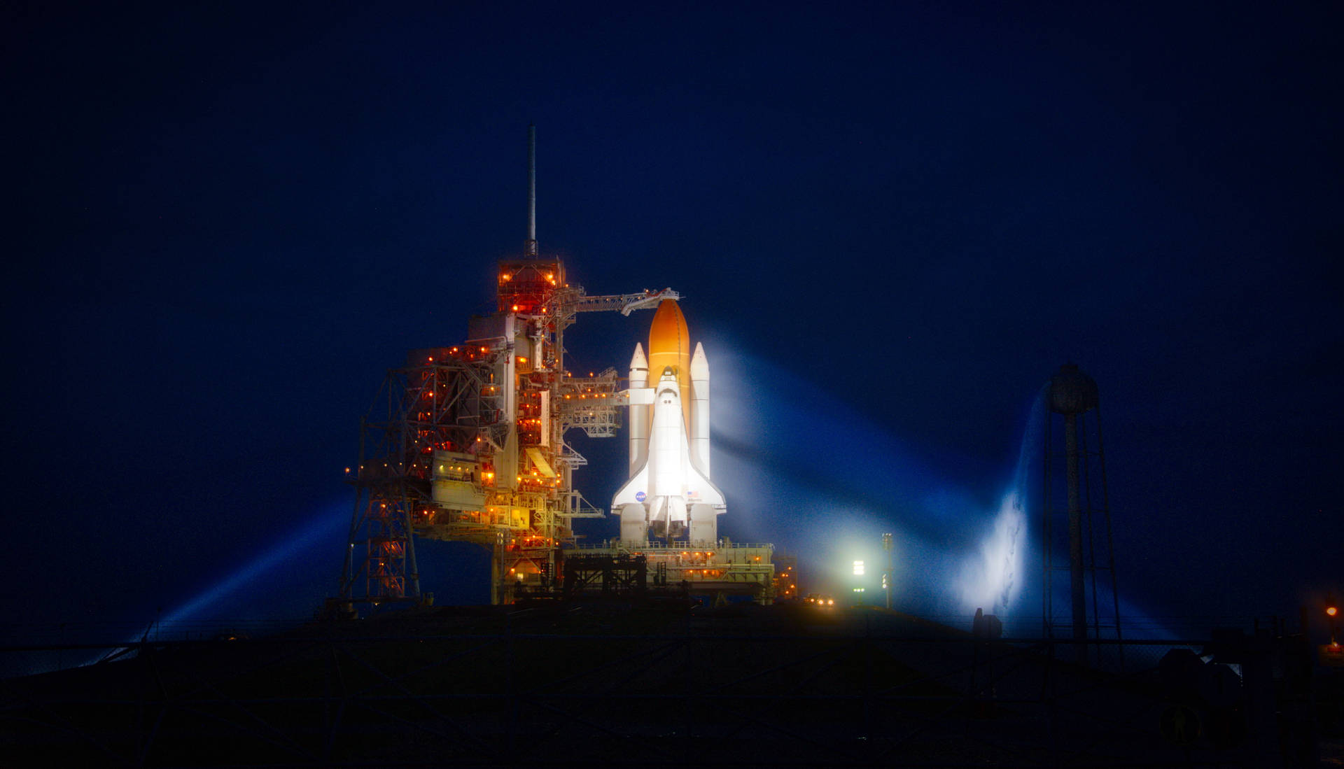 Kennedy Space Center Shuttle At Night Background