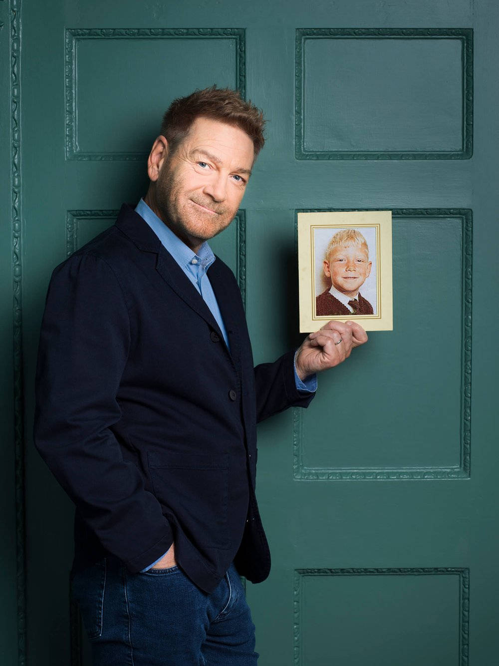 Kenneth Branagh Holds Photo