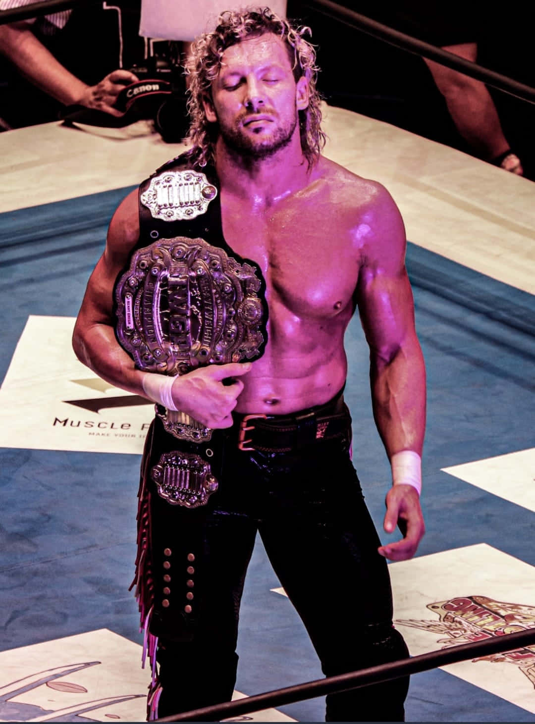 Kenny Omega Eyes Closed Purple Light Background