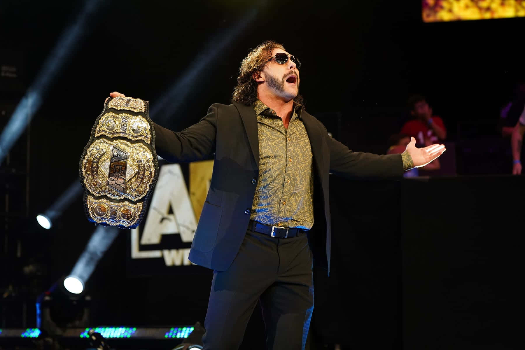 Kenny Omega Making A Grand Entrance During Aew Dynamite Event. Background